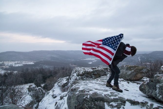 hikers with flag